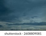 Dramatic dark storm rain clouds black sky background. Dark thunderstorm clouds rainny atmosphere. Meteorology danger windstorm disasters climate. Dark cloudscape storm disaster gloomy gray cloud sky