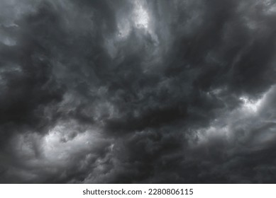 Dramatic dark storm rain clouds black sky background. Dark thunderstorm clouds rainny atmosphere. Meteorology danger windstorm disasters climate. Dark cloudscape storm disaster gloomy gray cloud sky