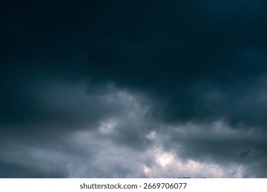 Dramatic dark storm rain clouds black sky background. Dark thunderstorm clouds rainny atmosphere. Meteorology danger windstorm disasters climate. Dark cloudscape storm disaster gloomy gray cloud sky