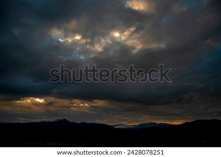 Dramatic dark storm rain clouds black sky background. Dark thunderstorm clouds rainny atmosphere. Meteorology danger windstorm disasters climate. Dark cloudscape storm disaster gloomy gray cloud sky