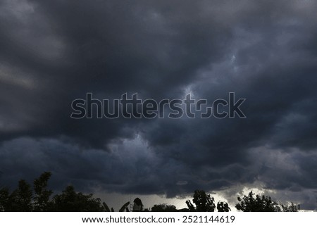 Dramatic dark storm rain clouds black sky background. Dark thunderstorm clouds rainny atmosphere. Meteorology danger windstorm disasters climate. Dark cloudscape storm disaster gloomy gray cloud sky