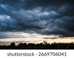 Dramatic dark storm thundercloud rain clouds on black sky background. Dark thunderstorm clouds rainny landscape. Meteorology danger windstorm disaster climate. Dark cloudscape storm disaster gray sky