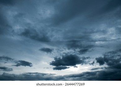 Dramatic dark storm thundercloud rain clouds on black sky background. Dark thunderstorm clouds rainny landscape. Meteorology danger windstorm disaster climate. Dark cloudscape storm disaster gray sky