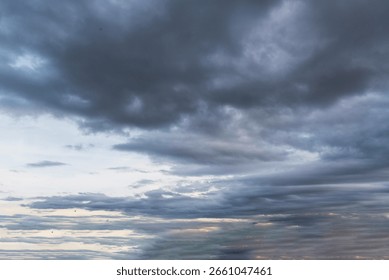 Dramatic dark storm thundercloud rain clouds on black sky background. Dark thunderstorm clouds rainny landscape. Meteorology danger windstorm disaster climate. Dark cloudscape storm disaster gray sky