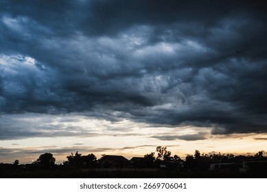 Dramatic dark storm thundercloud rain clouds on black sky background. Dark thunderstorm clouds rainny landscape. Meteorology danger windstorm disaster climate. Dark cloudscape storm disaster gray sky - Powered by Shutterstock - Get 15% off with code: PIKWIZARD15