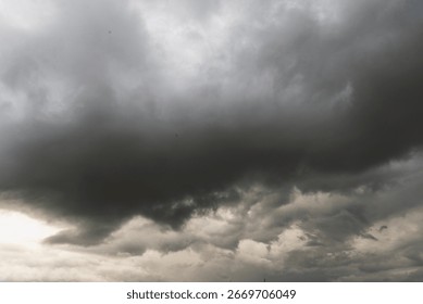 Dramatic dark storm thundercloud rain clouds on black sky background. Dark thunderstorm clouds rainny landscape. Meteorology danger windstorm disaster climate. Dark cloudscape storm disaster gray sky
