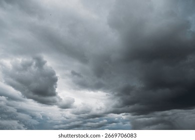 Dramatic dark storm thundercloud rain clouds on black sky background. Dark thunderstorm clouds rainny landscape. Meteorology danger windstorm disaster climate. Dark cloudscape storm disaster gray sky