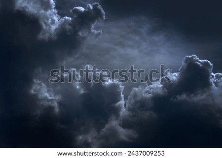 Dramatic dark storm thundercloud rain clouds on black sky background. Dark thunderstorm clouds rainny landscape. Meteorology danger windstorm disaster climate. Dark cloudscape storm disaster gray sky