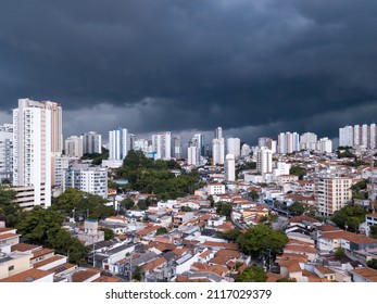 Dramatic drone aerial view of summer rain clouds in Pompeia neighborhood buildings and houses in São Paulo city before storm and flooding in the streets. Concept of climate crisis, weather, thunder. - Powered by Shutterstock