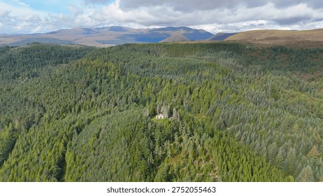 Dramatic Drone Perspective of Creag Ruadh Historical Monument, Secluded Scottish Wilderness Site Surrounded by Ancient Woodland, Fyrish Estate, Ross-shire, United Kingdom.