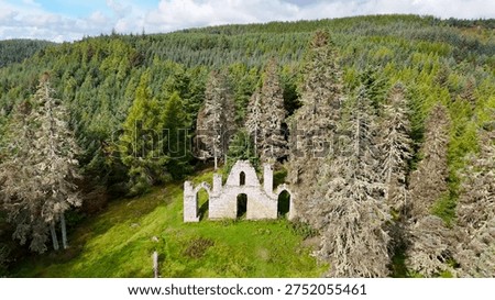 Dramatic Drone Perspective of Creag Ruadh Historical Monument, Secluded Scottish Wilderness Site Surrounded by Ancient Woodland, Fyrish Estate, Ross-shire, United Kingdom.