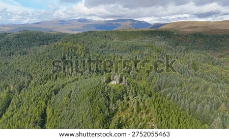 Dramatic Drone Perspective of Creag Ruadh Historical Monument, Secluded Scottish Wilderness Site Surrounded by Ancient Woodland, Fyrish Estate, Ross-shire, United Kingdom.