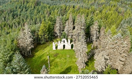 Dramatic Drone Perspective of Creag Ruadh Historical Monument, Secluded Scottish Wilderness Site Surrounded by Ancient Woodland, Fyrish Estate, Ross-shire, United Kingdom.