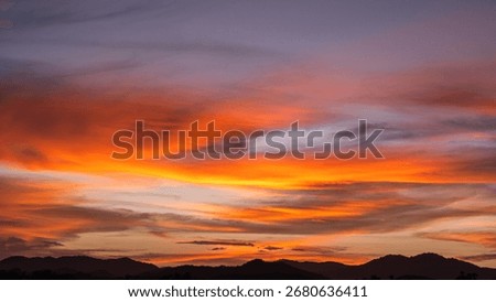 Dramatic Dusk, Evening Sky Clouds on Twilight over mountain horizon landscape Orange, purple Sunset Summer sky Golden Hour sun dawn on nature dark Blue Sky Background