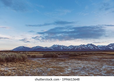 Dramatic Dusk sky over Arid plains against Sierra Nevada Mountains in the Owens River Valley near Mammoth Lakes - Powered by Shutterstock