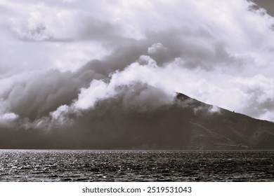 dramatic effect as a cloud engulfs the mountain