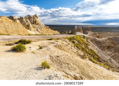 Dramatic eroded rock formations glowing in warm evening light at Badlands National Park, South Dakota