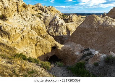Dramatic eroded rock formations glowing in warm evening light at Badlands National Park, South Dakota