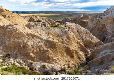 Dramatic eroded rock formations glowing in warm evening light at Badlands National Park, South Dakota