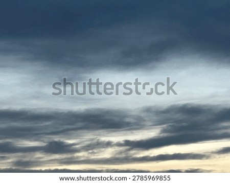 Dramatic evening clouds creating atmospheric natural sky background and outdoor weather environment at sunset