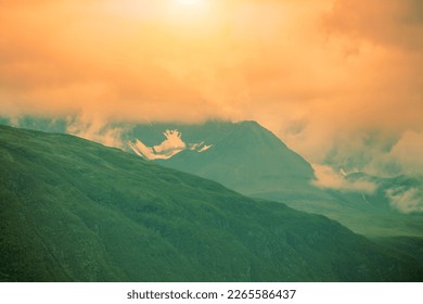Dramatic evening cloudy sky over mountains peaks