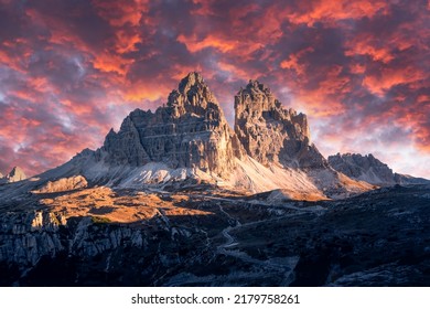 Dramatic evening landscape with Three peaks of Lavaredo mountains, glowing road and pink sunset sky. Auronzo refugio at Tre Cime Di Lavaredo National Park, Dolomite Alps, Trentino Alto adige, Italy - Shutterstock ID 2179758261