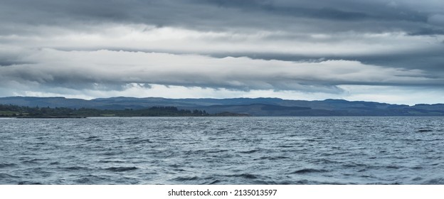 Dramatic Evening Sky Above The Crinan Canal, Storm Waves. Ardrishaig, Scotland, UK