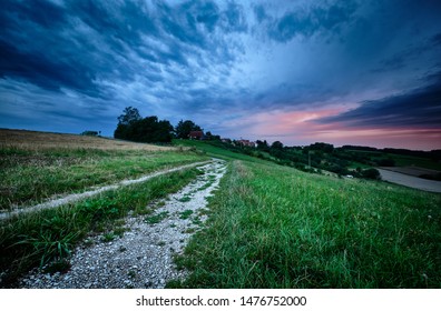 Dramatic evening sky with clouds  during sunset bringing bad weather into the countryside landscape in Germany near Tauchersreuth