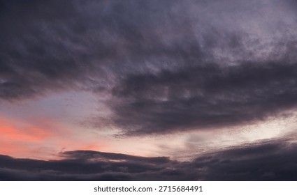 Dramatic evening sunset sky with clouds after storm.