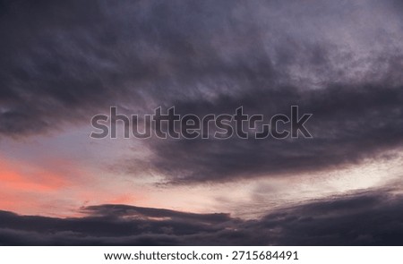 Dramatic evening sunset sky with clouds after storm.