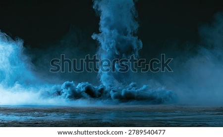A dramatic explosion of vibrant blue smoke and particles erupts from a dark, textured surface, creating an abstract and powerful visual.