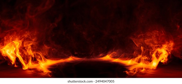 Dramatic fire and smoke effect glowing red and yellow colors exploding outwards with center space. Vivid and hot hell abstract or blazing fire background or wallpaper