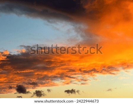 Dramatic firey sunrise clouds in the sky
