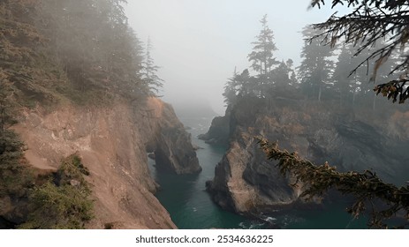 A dramatic and foggy coastal scene along the Oregon Coast. Towering cliffs, weathered by the elements, plunge into the deep turquoise waters below. - Powered by Shutterstock