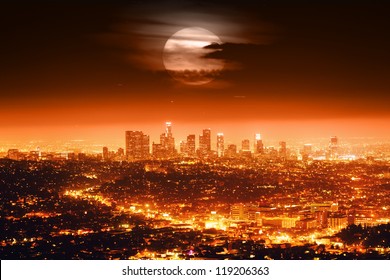 Dramatic Full Moon Over Los Angeles Skyline At Night.