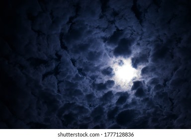 Dramatic glowing sun in the cloudscape background