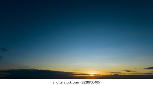 Dramatic golden and dark blue sunset sky abstract background. Dark blue sky in the evening. Sky at dusk. Sunset abstract background. Dusk and dawn concept. Beauty in nature.Majestic sky for wallpaper. - Shutterstock ID 2228908485
