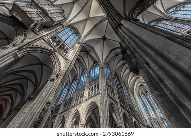 Dramatic gothic cathedral interior with vaulted ceiling and stained glass