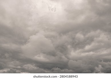 Dramatic Gray Storm Clouds Covering the Sky Before Rain. Dark gray storm clouds filling the sky before rainfall. Dramatic overcast weather with dense cloud formations creating an atmospheric natural background for weather, climate, and meteorology concepts.