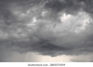 Dramatic grey raincloud landscape in the sky.