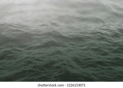 dramatic grey sea waves background. sea wave close up, low angle view