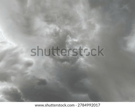 Dramatic grey storm cloud formation filling the sky with intense moody atmospheric weather scenery