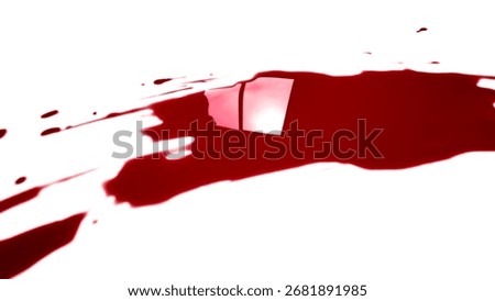 A dramatic, high-contrast shot of a deep red liquid spill with a reflective, glossy surface on a pristine white background. The abstract image can represent concepts of crime, danger.