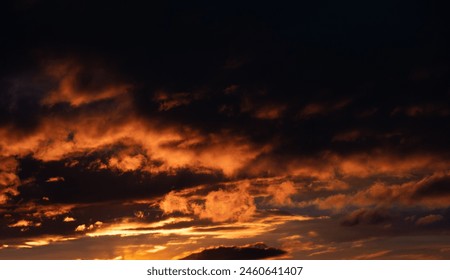 Dramatic illuminated clouds in the evening sky