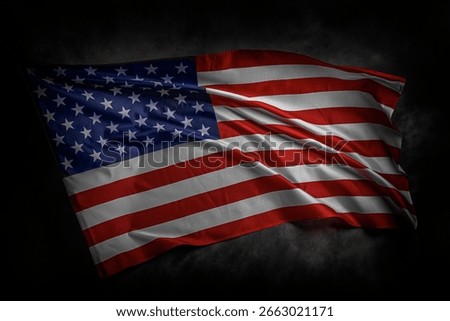 A dramatic image of the American flag waving against a dark cloudy background, symbolizing patriotism, freedom, and national pride.