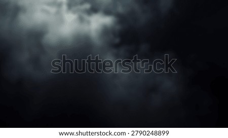 A dramatic image of dark, ominous clouds filling the sky. The atmospheric background creates a sense of foreboding and mystery, perfect for various creative projects.