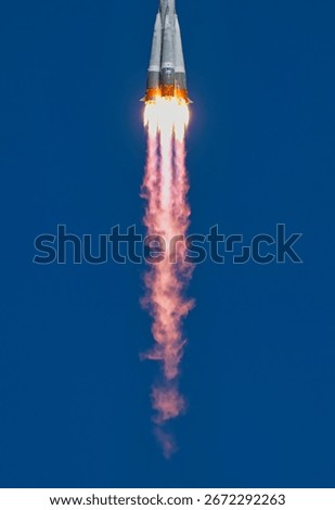 Dramatic image of rocket launching into sky with powerful flames. Space rocket launch smoke. Rocket launching into a clear sky with vibrant color. Elements of this image furnished by NASA