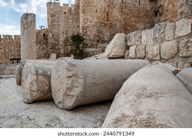Dramatic image of the ruins in front of the old city Jerusalem gates destroyed by the Roman’s with fallen columns and weathered stones