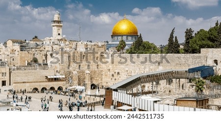 Dramatic image of the wailing wall in old city Jerusalem with the golden dome on the Temple Mount in Israel.