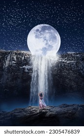 Dramatic and imaginary moon waterfall. moon waterfall in starry night. girl on cliff enjoying full moon night and waterfall.